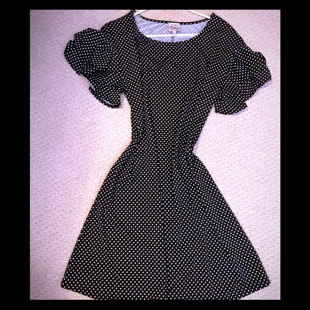 A cute dress. Never worn. Black and white polka